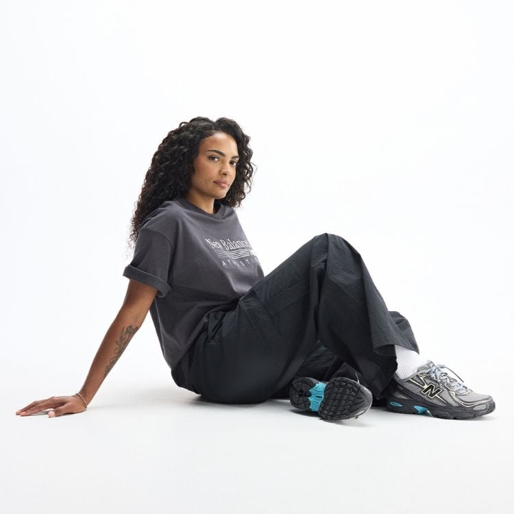Women sitting on the floor wearing new balance